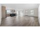 Open-concept living area showcasing modern flooring, bright lighting, and a seamless transition to the kitchen at 1321 Rabbit Ln., Conway, SC 29526