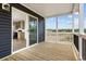 Porch with wood flooring, showcasing a sliding glass door entry to the home and views of the outdoors at 1321 Rabbit Ln., Conway, SC 29526
