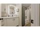 Modern bathroom with vanity, LED mirror, shower with curtain, and neutral tones at 1325 Rabbit Ln., Conway, SC 29526