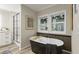 Elegant bathroom with a standalone tub, a modern shower, and sleek fixtures for a spa-like feel at 1325 Rabbit Ln., Conway, SC 29526