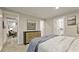 Relaxing bedroom showcasing a comfortable bed, a stylish dresser, and views into other rooms at 1325 Rabbit Ln., Conway, SC 29526