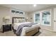 Stylishly furnished bedroom featuring a cozy bed, nightstand, and natural light from modern windows at 1325 Rabbit Ln., Conway, SC 29526