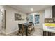 Charming dining area featuring a modern table set, large windows, and a serene atmosphere perfect for Gathering meals at 1325 Rabbit Ln., Conway, SC 29526