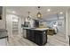 Spacious kitchen with a central island, stainless steel appliances, and open layout connecting to the living area at 1325 Rabbit Ln., Conway, SC 29526