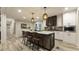 Well-appointed kitchen featuring modern pendant lights, an island with seating, and sleek cabinetry at 1325 Rabbit Ln., Conway, SC 29526