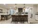 Stylish kitchen showcasing a center island with seating, modern pendant lighting, and an open view to the dining area at 1325 Rabbit Ln., Conway, SC 29526