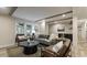 Cozy living room with modern decor, wood-look floors, and large windows for ample natural light at 1325 Rabbit Ln., Conway, SC 29526