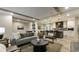 Open-concept living room flows into a stylish kitchen with bar seating and pendant lighting at 1325 Rabbit Ln., Conway, SC 29526