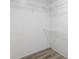 Spacious walk-in closet featuring ample shelving and neutral finishes for organized storage at 1325 Rabbit Ln., Conway, SC 29526