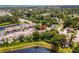 Aerial view of a quiet neighborhood surrounded by lush landscaping, a pond and nearby shopping at 1356 Glenns Bay Rd. # A202, Surfside Beach, SC 29575