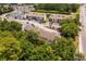 Aerial view shows the building surrounded by trees, providing shade, privacy and a park-like ambiance at 1356 Glenns Bay Rd. # A202, Surfside Beach, SC 29575