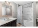 Bathroom featuring a vanity with mirror and a shower-tub combo with a shower curtain at 1356 Glenns Bay Rd. # A202, Surfside Beach, SC 29575