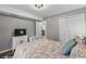 Cozy bedroom featuring a closet, TV, and a comfortable bed with patterned bedding at 1356 Glenns Bay Rd. # A202, Surfside Beach, SC 29575