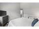 Comfortable bedroom features a queen bed, bedside tables, and a stylish dark-toned wood cabinet at 1356 Glenns Bay Rd. # A202, Surfside Beach, SC 29575