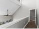 Bright second floor hallway with hardwood floors, neutral walls and an open railing overlooking the living room at 1356 Glenns Bay Rd. # A202, Surfside Beach, SC 29575