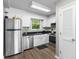 Modern kitchen with stainless steel appliances, sleek countertops, and ample cabinet space at 1356 Glenns Bay Rd. # A202, Surfside Beach, SC 29575