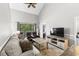 Bright living room features high ceilings, neutral tones, and access to a private balcony at 1356 Glenns Bay Rd. # A202, Surfside Beach, SC 29575
