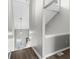 Modern staircase with hardwood floors, neutral walls, pendant lighting, and an entry view at 1356 Glenns Bay Rd. # A202, Surfside Beach, SC 29575