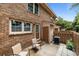 Rear exterior view featuring brickwork, patio area, and well-maintained surroundings at 1409 Highway 15 # 4, Myrtle Beach, SC 29577