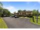 Exterior of the tan and brick townhomes with parking lot at 1409 Highway 15 # 4, Myrtle Beach, SC 29577