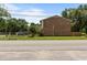 Street view of the brick townhomes with landscaping at 1409 Highway 15 # 4, Myrtle Beach, SC 29577