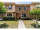 Charming townhome showcasing brick facade, complemented by lush greenery and inviting front entrance at 1409 Highway 15 # 4, Myrtle Beach, SC 29577
