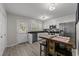 Modern kitchen with stainless steel appliances, ample cabinets, and a dining area at 1409 Highway 15 # 4, Myrtle Beach, SC 29577