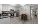 Bright kitchen featuring stainless steel appliances, granite countertops, and a cozy dining space at 1409 Highway 15 # 4, Myrtle Beach, SC 29577