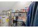 Well-stocked storage area featuring wire racks, a water heater, and lots of supplies at 1409 Highway 15 # 4, Myrtle Beach, SC 29577