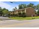 Street view of townhomes with parking lot and sidewalk at 1409 Highway 15 # 4, Myrtle Beach, SC 29577