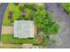 Aerial view of the home, highlighting a well manicured lot, beautiful landscaping, and proximity to the water at 141 Cayman Loop, Pawleys Island, SC 29585