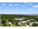 Aerial view of 141 Cayman Loop, highlighting the home's location near lush greenery and the ocean at 141 Cayman Loop, Pawleys Island, SC 29585