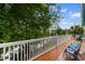 View from the balcony, showcasing outdoor seating and lush greenery, perfect for relaxation at 141 Cayman Loop, Pawleys Island, SC 29585