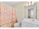 Bathroom featuring a vanity with a mirror and a shower with a vibrant curtain at 141 Cayman Loop, Pawleys Island, SC 29585