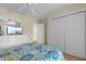 This bedroom features a dresser with a TV, a closet, and views into the hall at 141 Cayman Loop, Pawleys Island, SC 29585