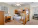 This bedroom features a wooden bunkbed, neutral walls, and a ceiling fan at 141 Cayman Loop, Pawleys Island, SC 29585
