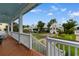 Inviting front porch view of neighborhood homes, framed by lush landscaping and a charming neighborhood street at 141 Cayman Loop, Pawleys Island, SC 29585