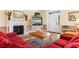 Bright living room featuring a marble fireplace and a beach-themed decorative display at 141 Cayman Loop, Pawleys Island, SC 29585