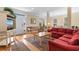 Inviting living room with a comfortable red sectional couch and charming decor at 141 Cayman Loop, Pawleys Island, SC 29585