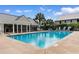 Community pool with lounge chairs, offering a refreshing oasis for relaxation and recreation at 141 Cayman Loop, Pawleys Island, SC 29585