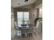 Cozy dining room features a round table, comfortable seating, and ample natural light at 1432 Seahouse Ct., Surfside Beach, SC 29575