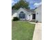 Charming one-story home with a manicured lawn, mature landscaping, and a welcoming entry at 1432 Seahouse Ct., Surfside Beach, SC 29575