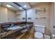Well-lit bathroom features granite countertop and modern fixtures at 1501 Ocean Blvd. S # 242, Myrtle Beach, SC 29577