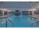 Indoor swimming pool featuring a fountain and lounge chairs for relaxation at 1501 Ocean Blvd. S # 242, Myrtle Beach, SC 29577