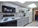 The kitchen has modern appliances, ample cabinet space and tile backsplash at 1501 Ocean Blvd. S # 242, Myrtle Beach, SC 29577