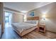 Comfortable bedroom with king-sized bed, lamps, and minimalist decor at 1501 Ocean Blvd. S # 242, Myrtle Beach, SC 29577