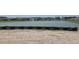 Scenic view of a community pond, with a fountain, surrounded by neighborhood homes and landscaping at 1531 Breakwater Dr., Little River, SC 29566
