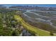An aerial perspective revealing lush golf courses intertwined with waterfront views and luxurious homes in a scenic setting at 1551 Spinnaker Dr. # 5312, North Myrtle Beach, SC 29582