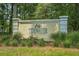 Tidewater Golf Club and Plantation community sign surrounded by greenery, showing landscaping and entrance at 1551 Spinnaker Dr. # 5312, North Myrtle Beach, SC 29582
