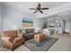 Comfortable living room with a ceiling fan, decorative painting and a glimpse into a modern kitchen at 1551 Spinnaker Dr. # 5312, North Myrtle Beach, SC 29582